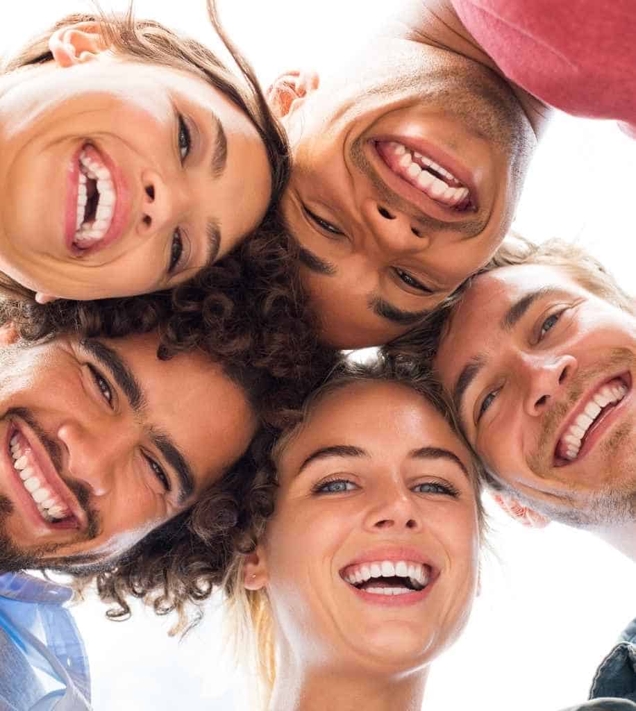 Smiling person showcasing white teeth after laser whitening treatment Bolton