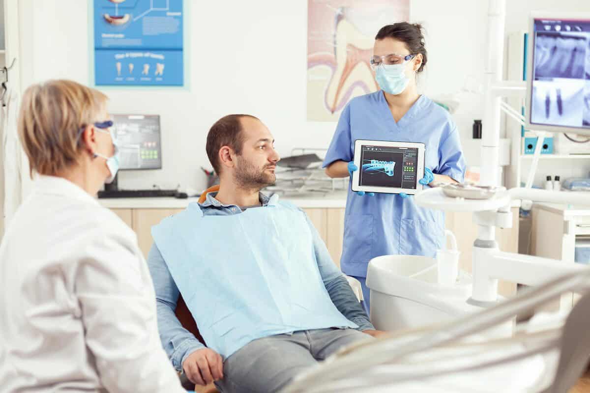 Laser teeth whitening treatment being applied by a dental professional Bolton