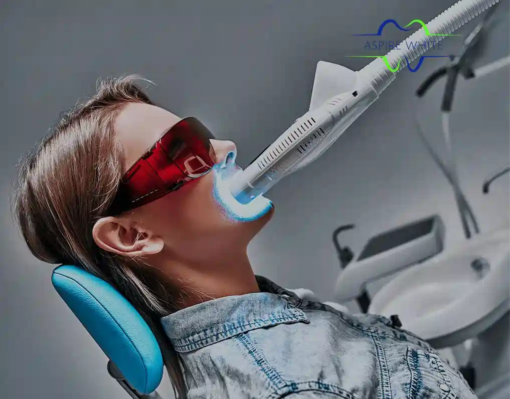 Patient relaxing in clinic chair during 1 hour laser teeth whitening session Bolton